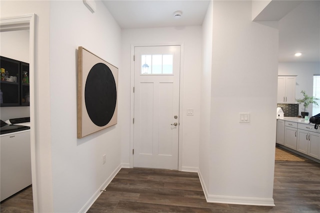 foyer entrance with recessed lighting, baseboards, and dark wood finished floors