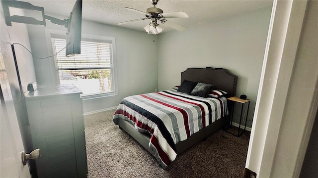 bedroom featuring baseboards, carpet, ceiling fan, and a textured ceiling