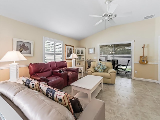 living room with visible vents, baseboards, ceiling fan, vaulted ceiling, and light tile patterned floors