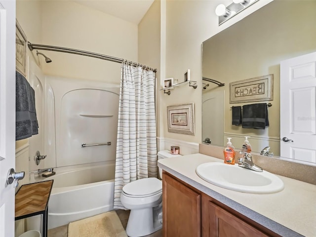 bathroom with vanity, toilet, and shower / tub combo with curtain