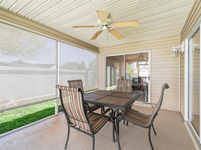 sunroom / solarium featuring ceiling fan