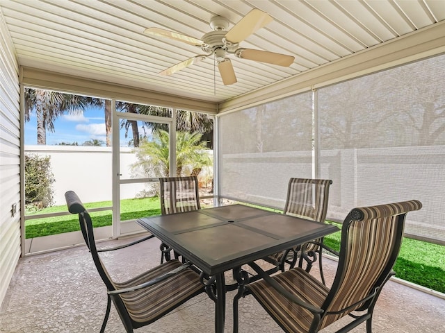 sunroom with a ceiling fan