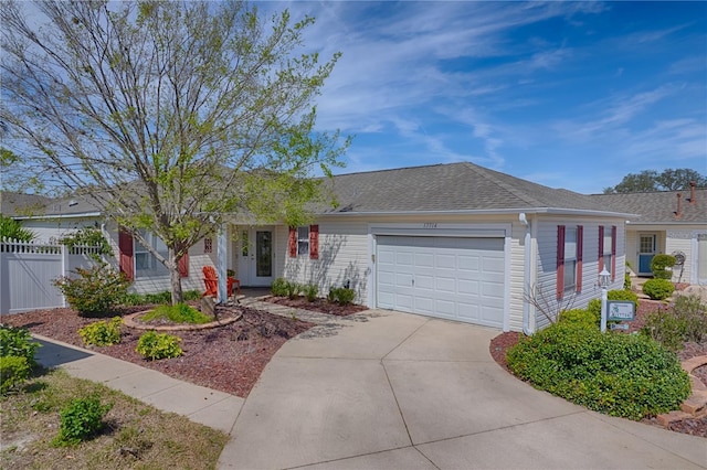single story home with driveway, a gate, fence, a shingled roof, and a garage