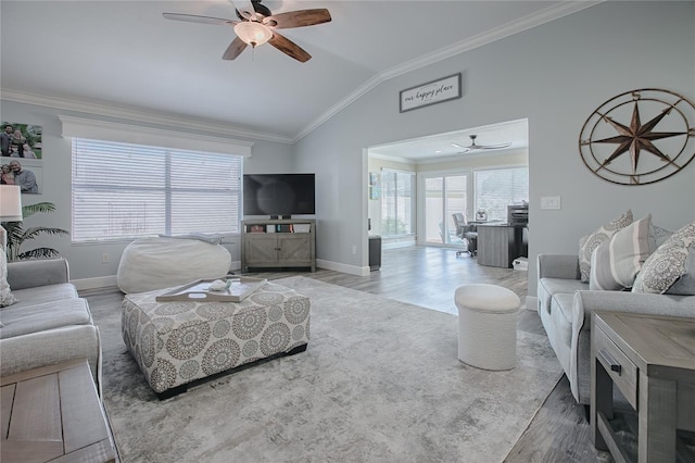living area with light wood finished floors, lofted ceiling, baseboards, ceiling fan, and ornamental molding