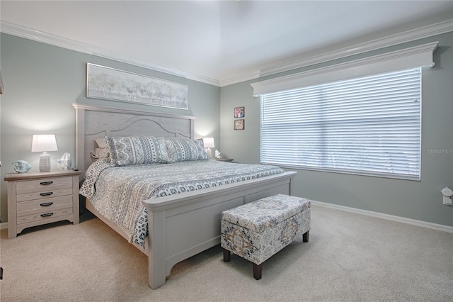 bedroom with light colored carpet, crown molding, and baseboards
