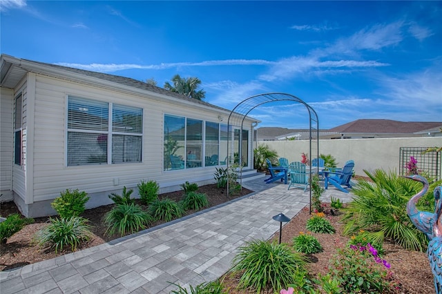 view of patio / terrace featuring fence