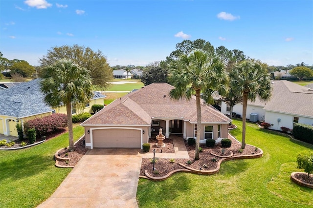 single story home featuring a front lawn, concrete driveway, an attached garage, and a shingled roof