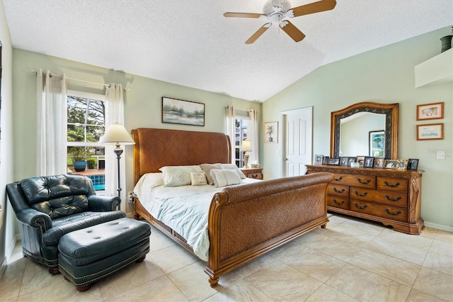 bedroom featuring light tile patterned floors, ceiling fan, a textured ceiling, and lofted ceiling