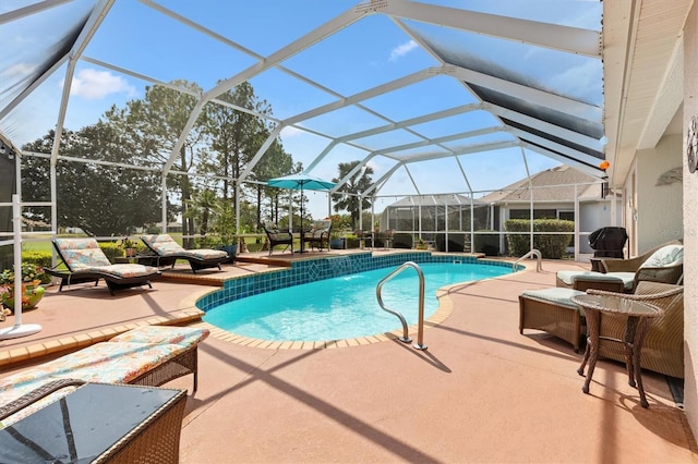 pool with a patio and a lanai