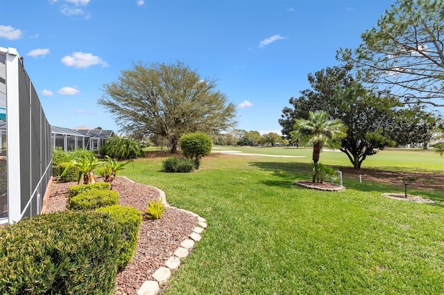 view of yard with a lanai