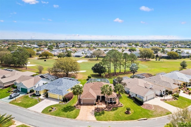 bird's eye view with view of golf course and a residential view