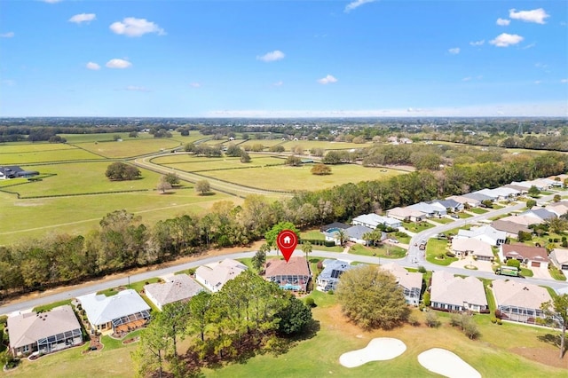 birds eye view of property with a rural view and a residential view