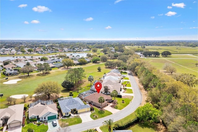 bird's eye view featuring a residential view and a water view