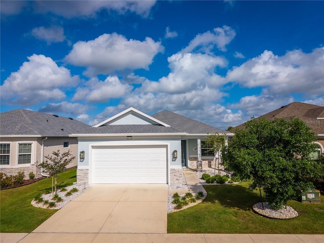 2174 Wallingford Loop, Mount Dora, FL 32757 - ranch-style home with stucco siding, driveway, a front lawn, and an attached garage