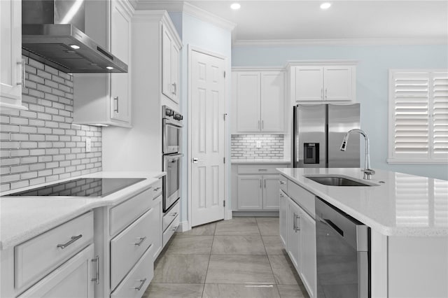 2174 Wallingford Loop, Mount Dora, FL 32757 - kitchen featuring wall chimney range hood, appliances with stainless steel finishes, tasteful backsplash, white cabinets, and recessed lighting