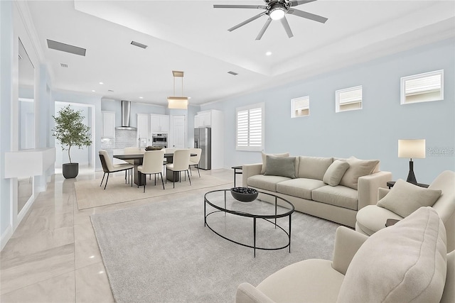 2174 Wallingford Loop, Mount Dora, FL 32757 - living area with ceiling fan, a raised ceiling, and recessed lighting