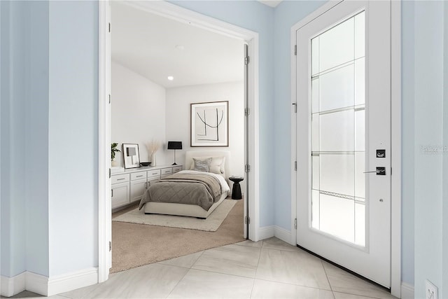 2174 Wallingford Loop, Mount Dora, FL 32757 - bedroom featuring baseboards and light carpet