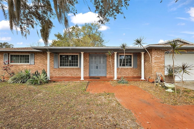 ranch-style house with brick siding and an attached garage