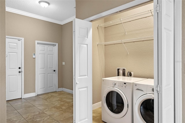 laundry area featuring laundry area, crown molding, baseboards, and separate washer and dryer