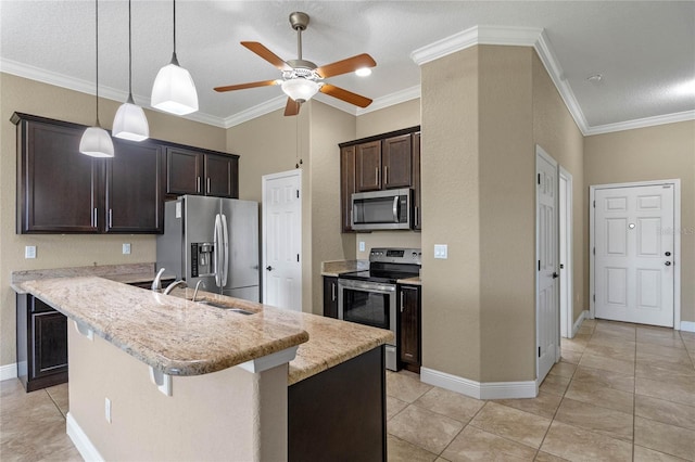 kitchen featuring ornamental molding, decorative light fixtures, a kitchen breakfast bar, stainless steel appliances, and dark brown cabinetry