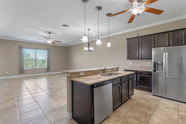 kitchen with crown molding, visible vents, appliances with stainless steel finishes, and a sink