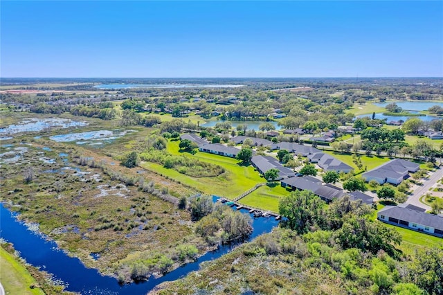 bird's eye view featuring a water view and a residential view