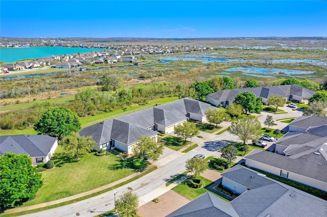 birds eye view of property featuring a residential view and a water view