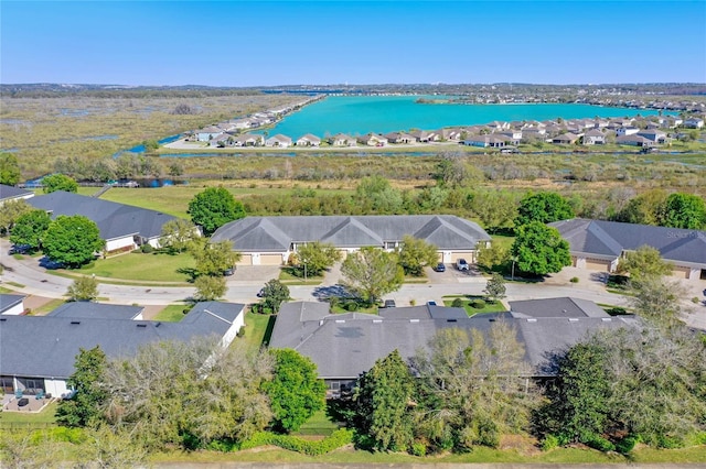 birds eye view of property with a residential view and a water view