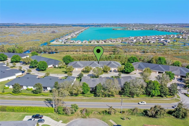 aerial view featuring a water view and a residential view