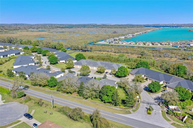 bird's eye view featuring a water view and a residential view