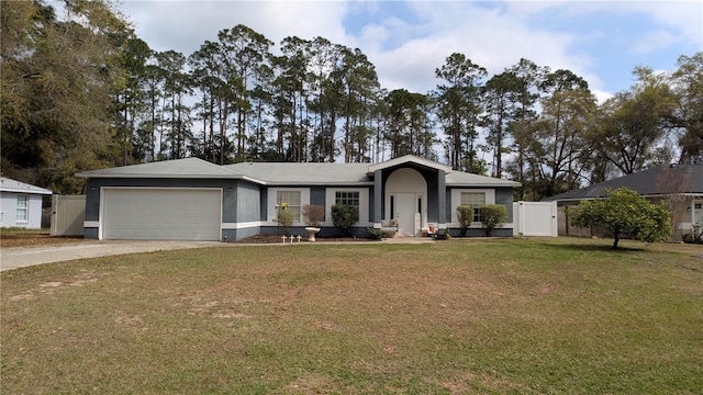 ranch-style home with a front lawn, concrete driveway, an attached garage, and a gate