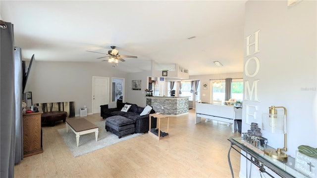 living room featuring light wood-style flooring, a ceiling fan, and vaulted ceiling