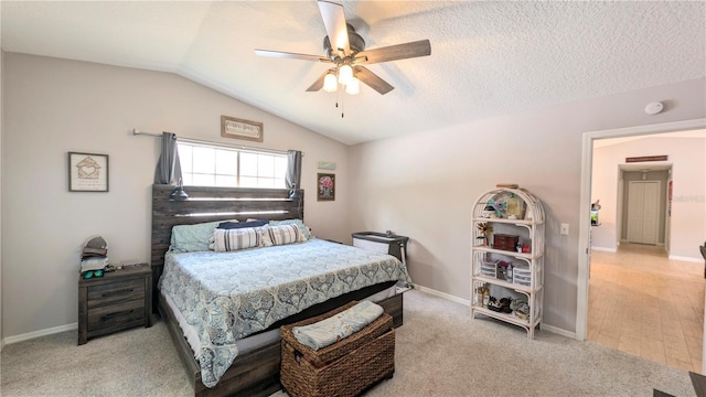 bedroom with lofted ceiling, a ceiling fan, light colored carpet, and baseboards