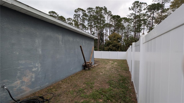 view of yard with a fenced backyard