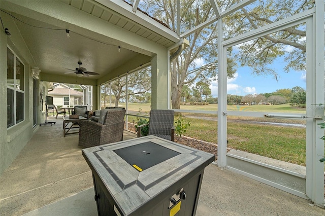 sunroom / solarium with ceiling fan