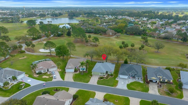 birds eye view of property with a residential view and a water view