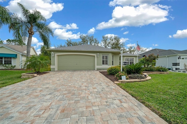 ranch-style house featuring stucco siding, an attached garage, decorative driveway, and a front yard