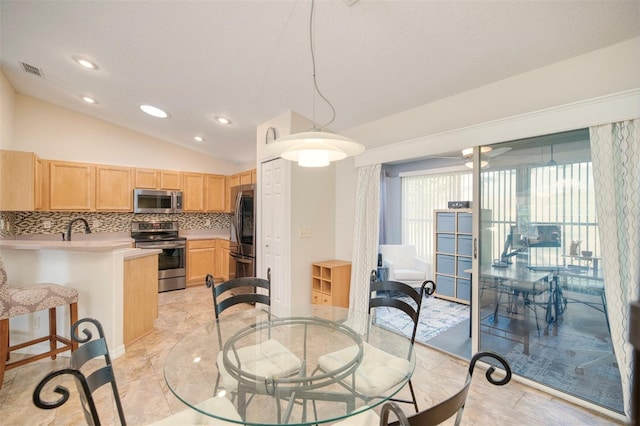 dining space featuring recessed lighting, visible vents, and lofted ceiling