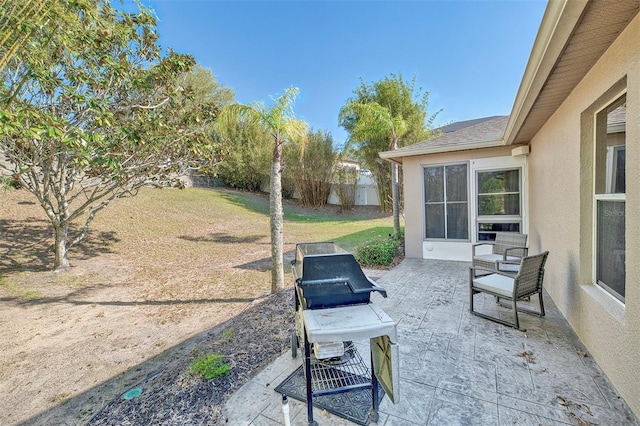 view of patio / terrace featuring fence