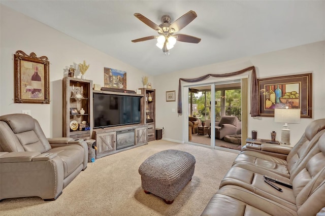 carpeted living area with baseboards, a ceiling fan, and lofted ceiling