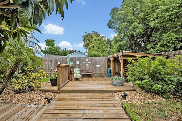 wooden deck featuring fence