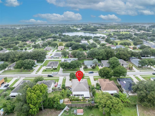 drone / aerial view with a residential view and a water view