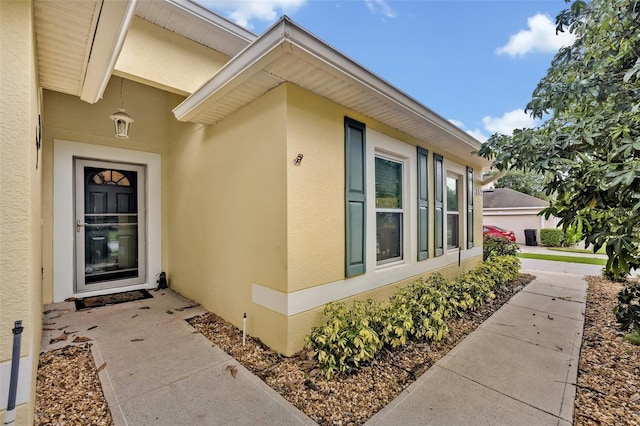 257 Winding Cove Ave, Apopka, FL 32703 - doorway to property featuring stucco siding
