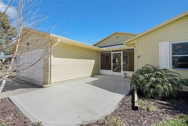 entrance to property with a patio