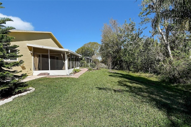 view of yard with a sunroom