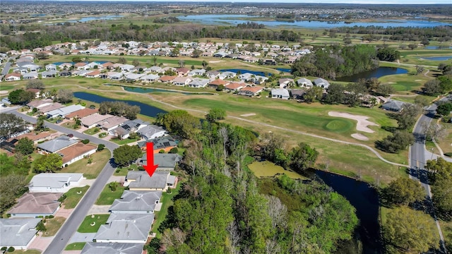 bird's eye view with a residential view, golf course view, and a water view