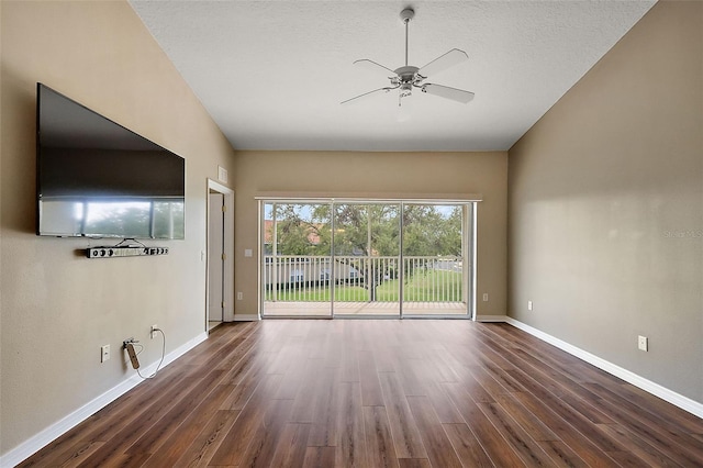 5359 Compass Pt, Oxford, FL 34484 - empty room with dark wood-style floors, a ceiling fan, baseboards, and a textured ceiling
