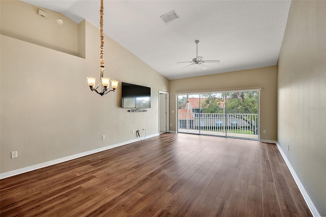 5359 Compass Pt, Oxford, FL 34484 - unfurnished room with wood finished floors, visible vents, baseboards, high vaulted ceiling, and ceiling fan with notable chandelier