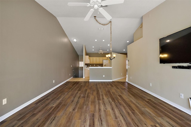 5359 Compass Pt, Oxford, FL 34484 - unfurnished living room with wood finished floors, recessed lighting, ceiling fan with notable chandelier, and baseboards