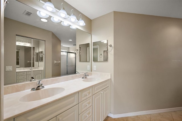 5359 Compass Pt, Oxford, FL 34484 - full bathroom featuring double vanity, visible vents, a stall shower, and a sink